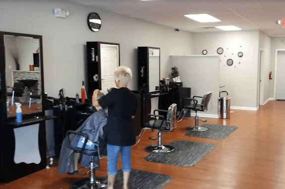 Shannon at work cutting hair